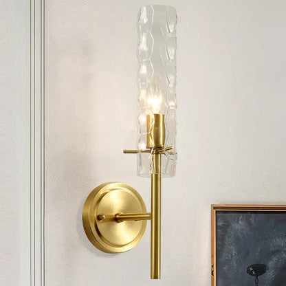 Brass dimpled glass wall light sconce with clear shade and round backplate on Tampa Home & Garden Store