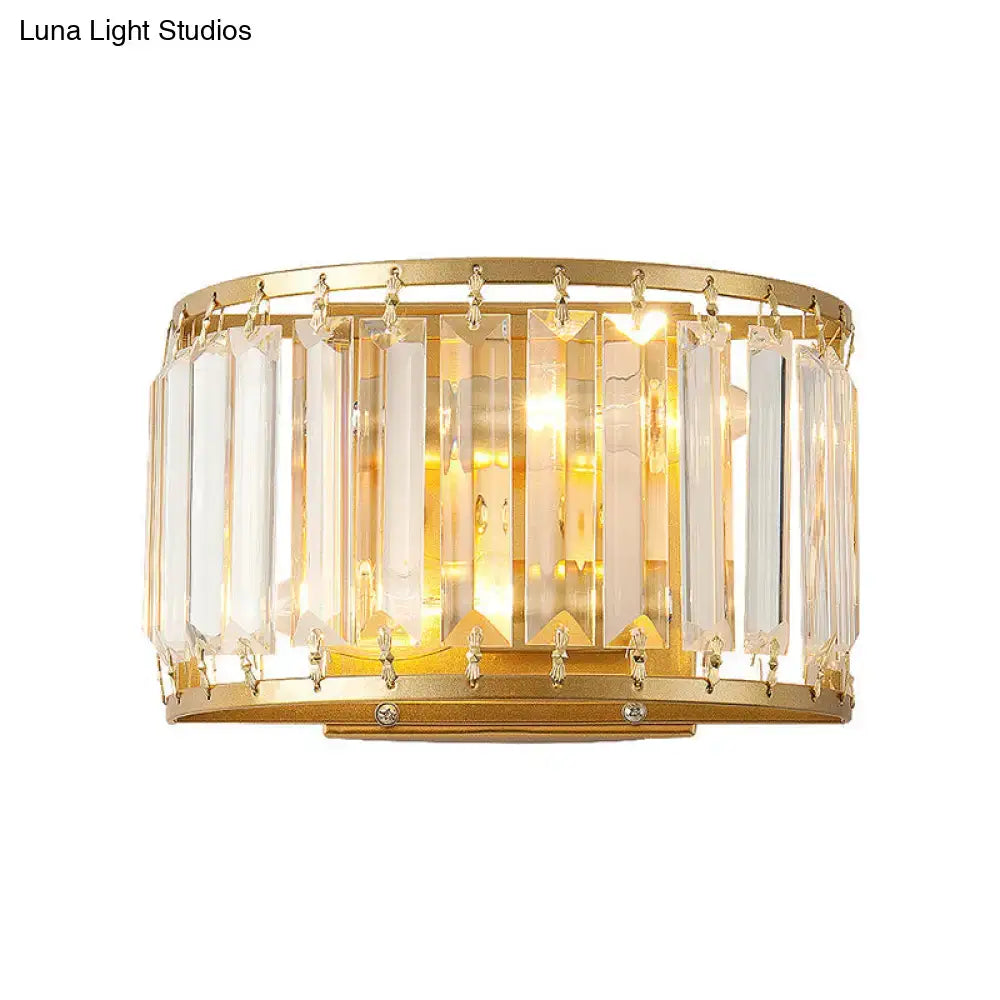 Brass crystal drum wall sconce by Decorbites with gold finish and hanging prisms on Tampa Home & Garden Store