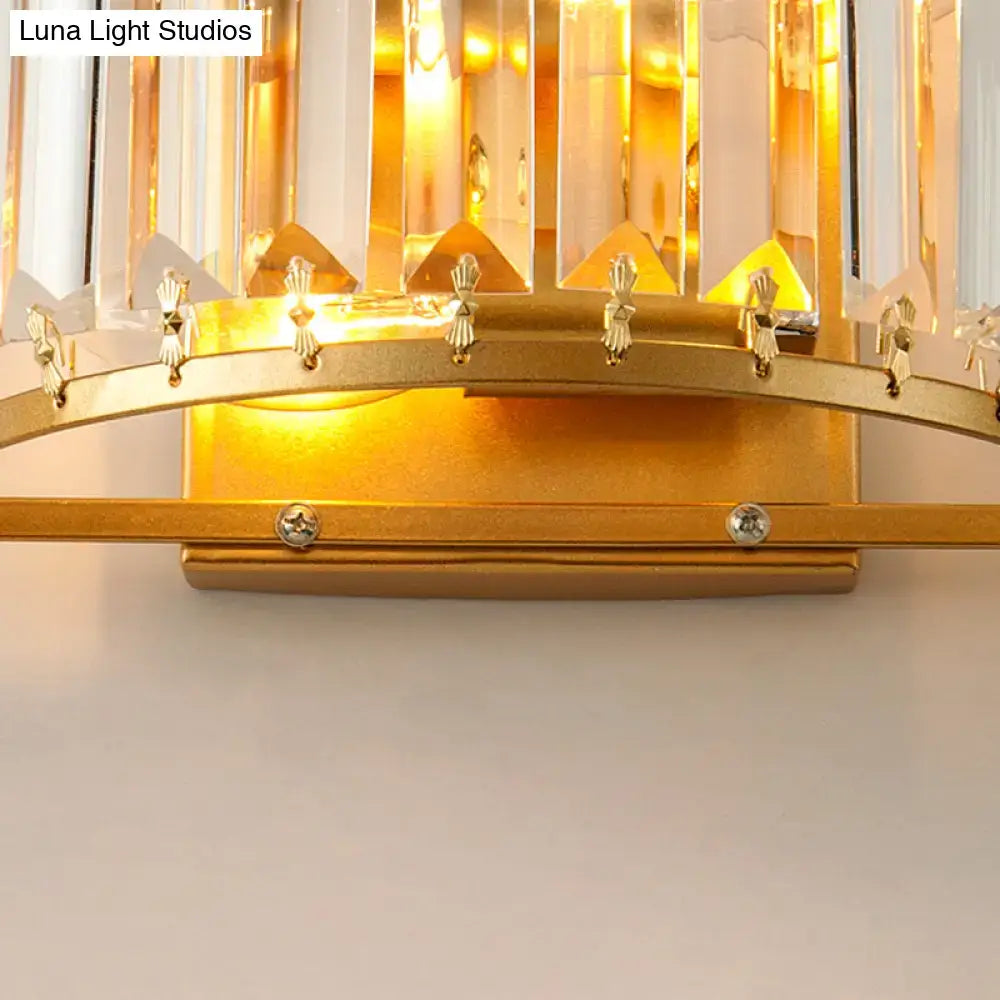 Brass crystal drum wall sconce by Decorbites with gold metal base and hanging prisms on Tampa Home & Garden Store