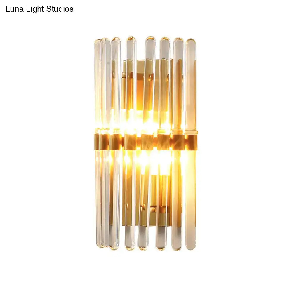 Decorbites brass crystal sconce lamp with glass tube rods, warm golden glow on Tampa Home & Garden Store