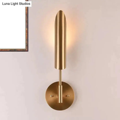 Decorbites brass LED wall lamp sconce with tall cylindrical form and round wall mount on Tampa Home & Garden Store