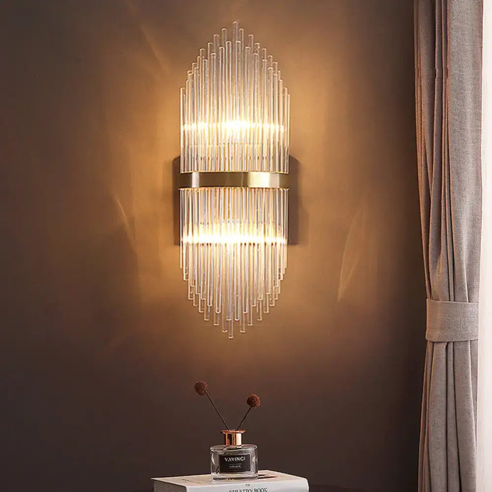 Brass fluted glass sconce with trailing arm design by Decorbites on dark wall on Tampa Home & Garden Store