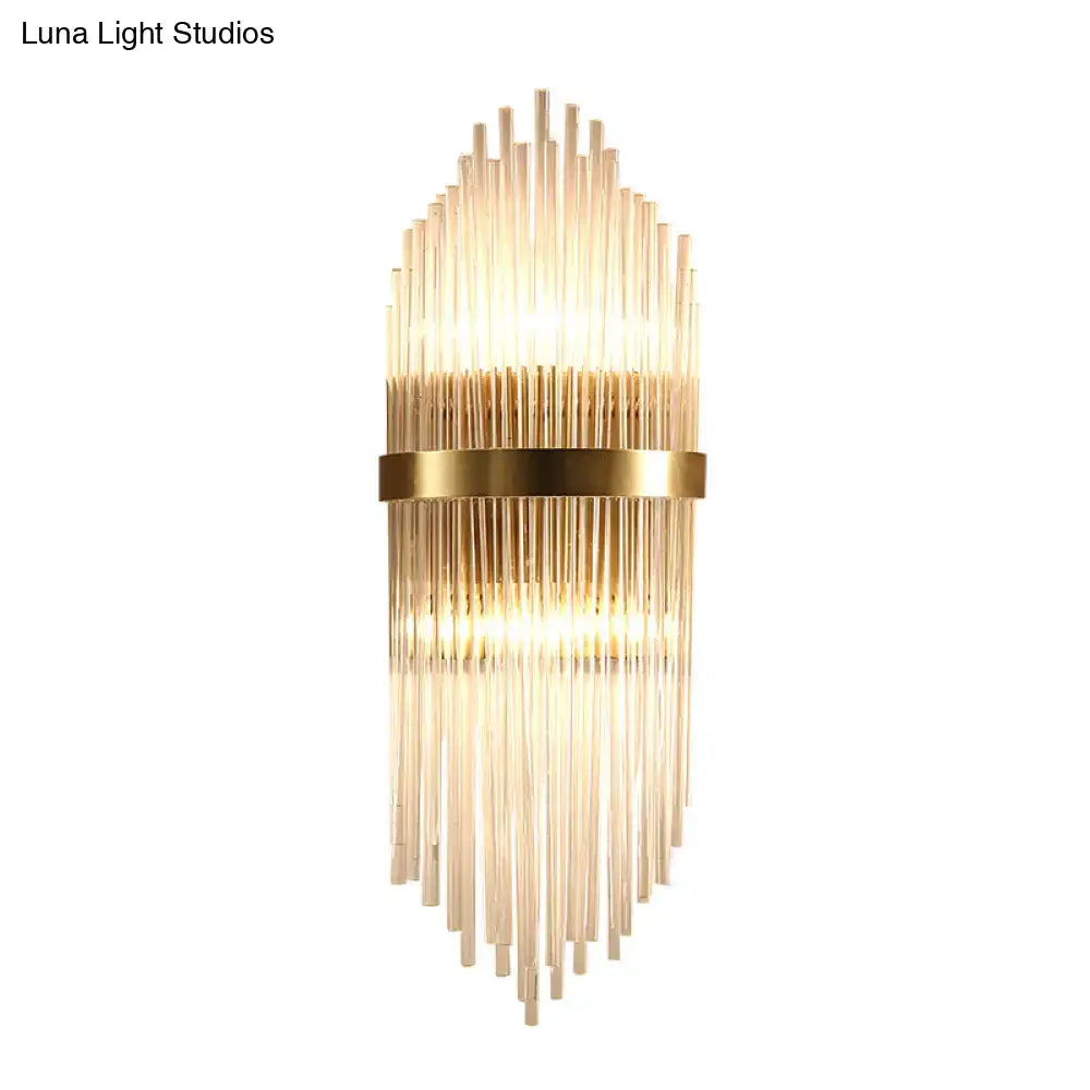 Brass fluted glass sconce with trailing arm design, warm glow wall light Decorbites on Tampa Home & Garden Store