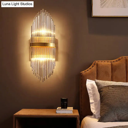 Brass fluted glass sconce with trailing arm design, Decorbites wall light on Tampa Home & Garden Store