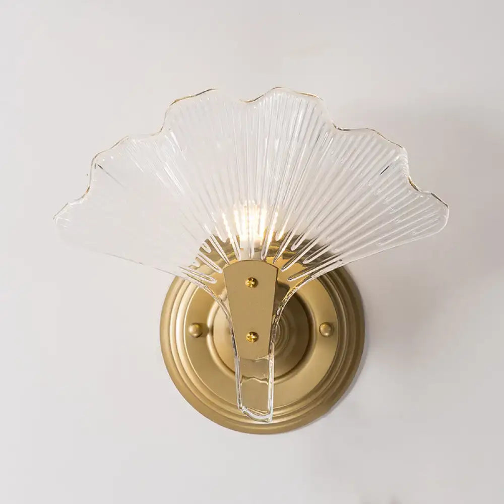 Brass Ginkgo Wall Sconce with glass leaf shade and round backplate on Tampa Home & Garden Store