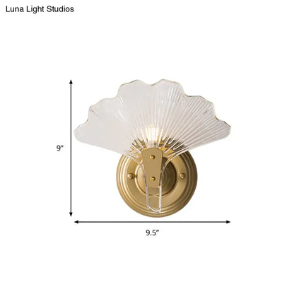 Brass Ginkgo Wall Sconce with frosted glass leaf shade and gold backplate by Decorbites on Tampa Home & Garden Store