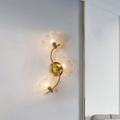 Brass Ginkgo Wall Sconce with three frosted glass leaf shades on curved brass arms on Tampa Home & Garden Store