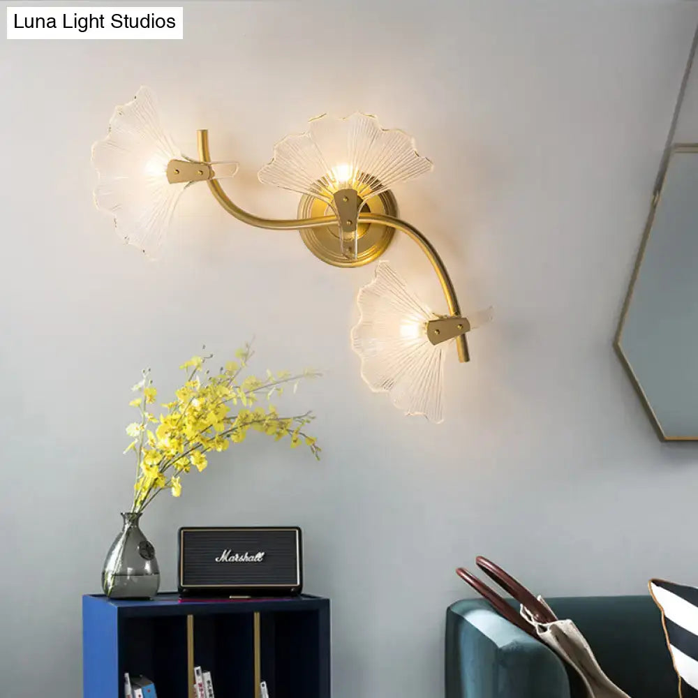 Brass Ginkgo Wall Sconce with three glass leaf shades on curved brass arms by Decorbites on Tampa Home & Garden Store