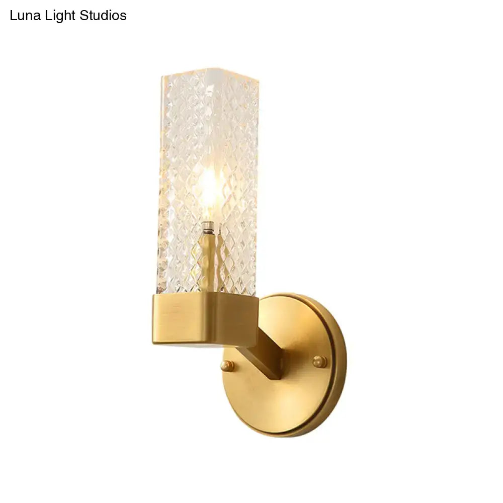 Brass wall lamp with cubic lattice glass shade and round mounting plate on Tampa Home & Garden Store