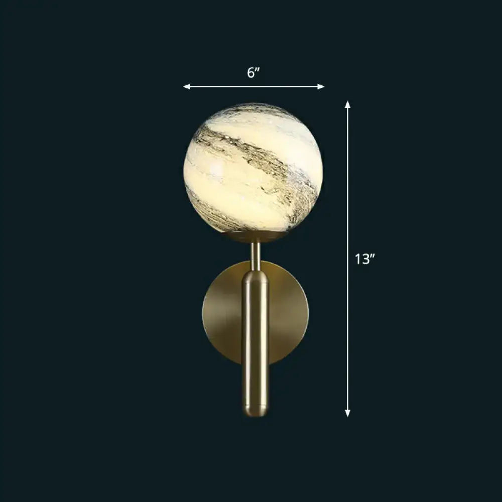 Decorbites glass ball wall sconce with 6in marbled globe and brass backplate on Tampa Home & Garden Store