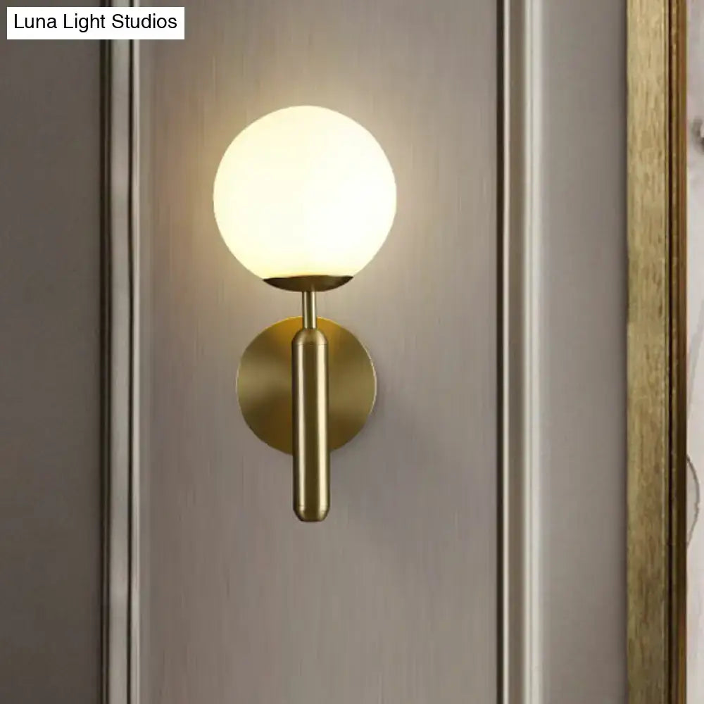 Glass Ball Wall Sconce by Decorbites with brass finish and frosted globe on Tampa Home & Garden Store