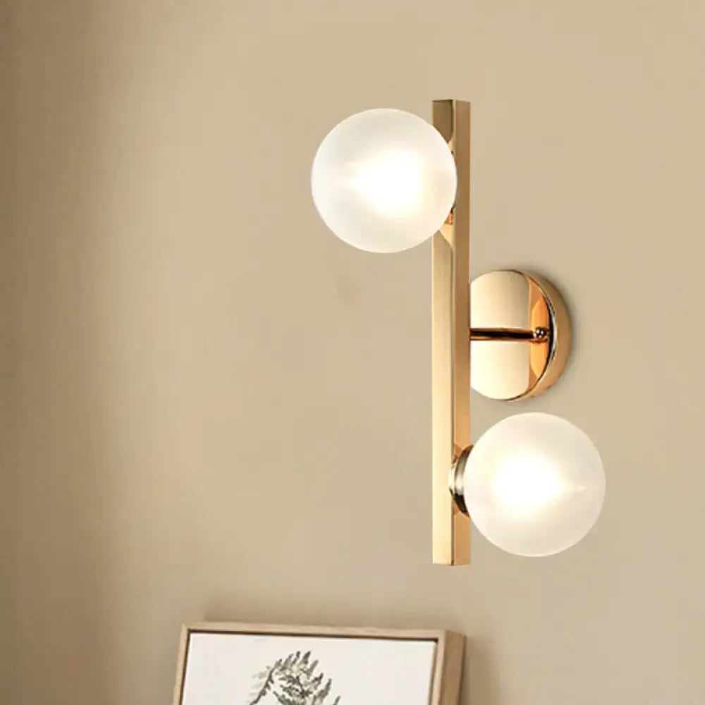 Brass dual-globe opal wall light by Decorbites, brass sconce with two frosted glass globes on Tampa Home & Garden Store