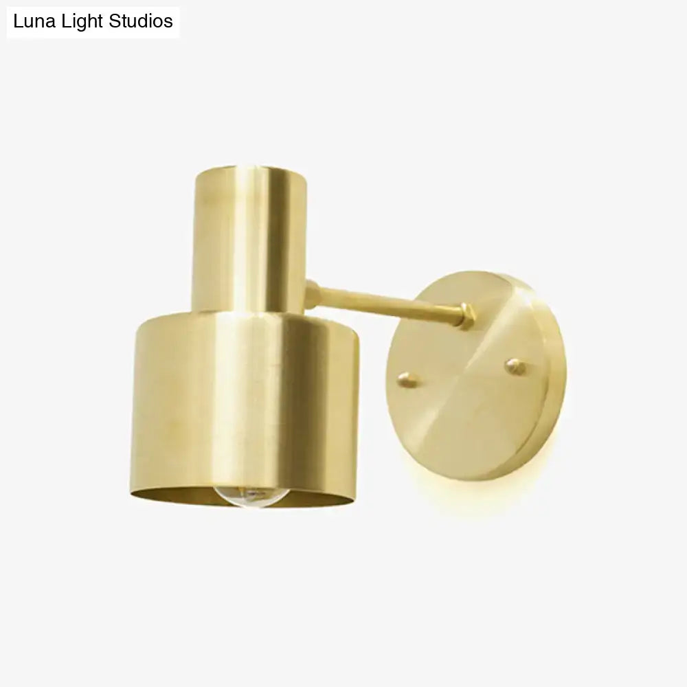 Brass grenade-style wall light by Decorbites, gold-toned cylindrical sconce with round backplate on Tampa Home & Garden Store