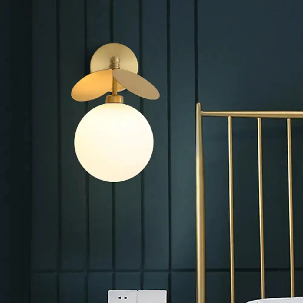Modern brass leaf wall lamp with cream glass globe bedroom sconce by Decorbites on Tampa Home & Garden Store