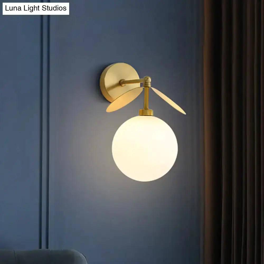 Modern brass leaf wall lamp with cream glass shade, bedroom sconce by Decorbites on Tampa Home & Garden Store