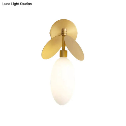 Modern brass leaf wall lamp with cream glass shade bedroom sconce by Decorbites on Tampa Home & Garden Store