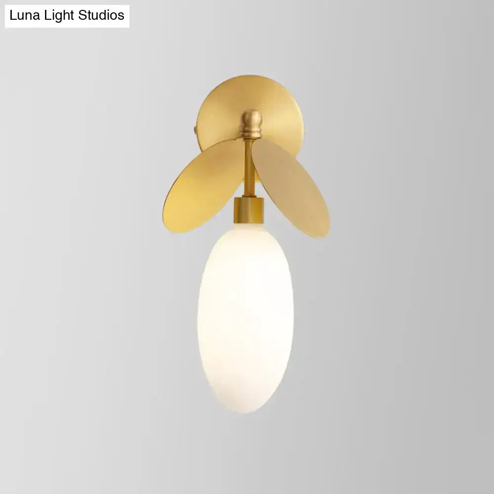 Modern brass leaf wall lamp with cream glass shade bedroom sconce by Decorbites on Tampa Home & Garden Store