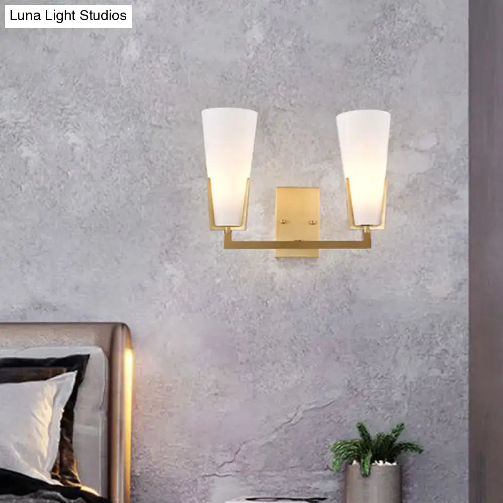 Brass white glass wall sconce with dual tapered shades and brass backplate Decorbites on Tampa Home & Garden Store