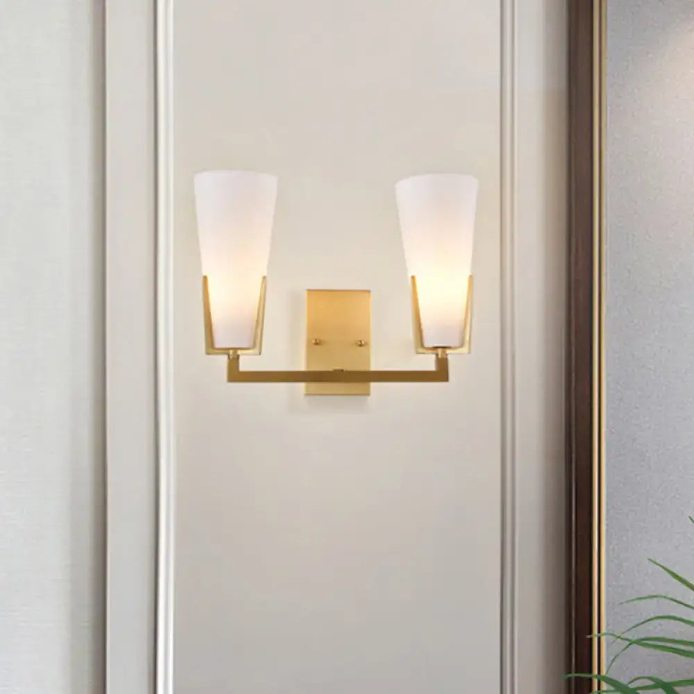 Brass white glass wall sconce by Decorbites, dual-arm fixture with frosted glass shades on Tampa Home & Garden Store