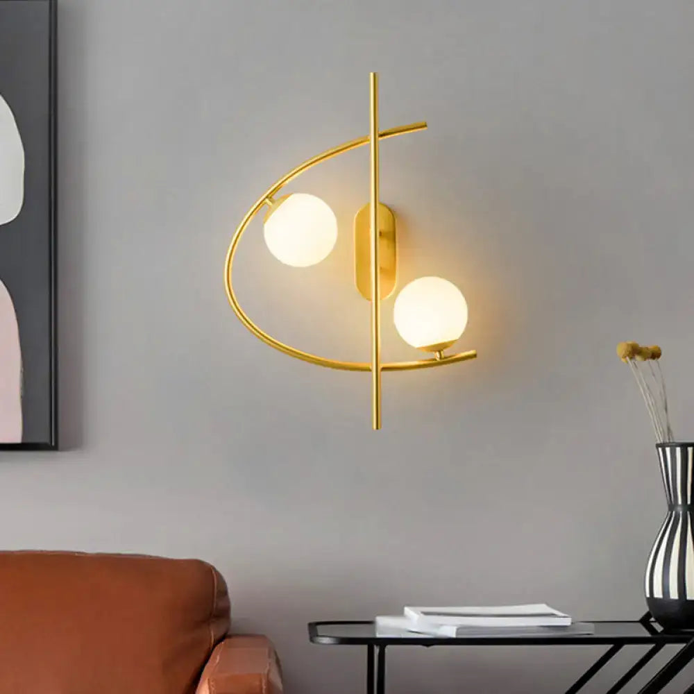 Decorbites brass milk glass post-modern wall sconce with dual globe lights on curved frame on Tampa Home & Garden Store