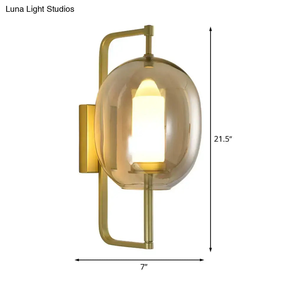 Gold oval glass hallway sconce by Decorbites with brass finish and amber shade on Tampa Home & Garden Store