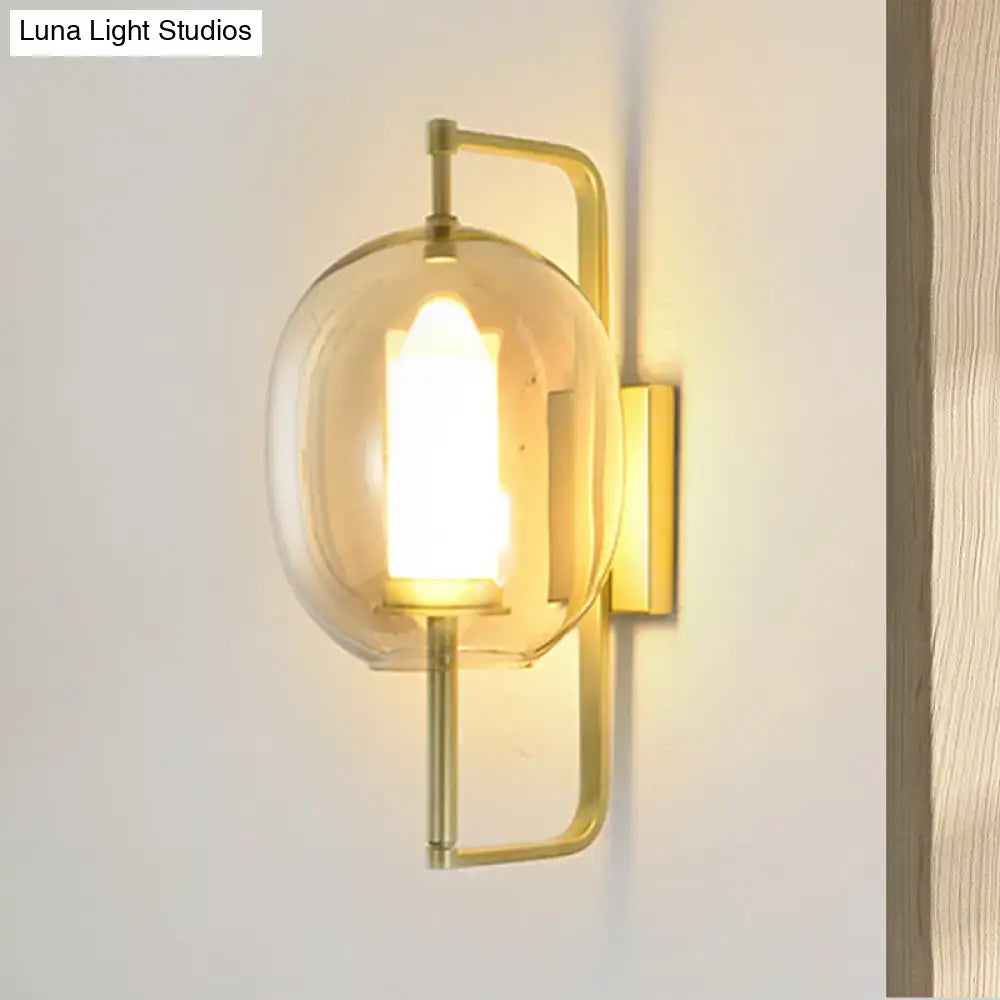 Gold oval glass hallway sconce with brass finish and clear globe shade by Decorbites on Tampa Home & Garden Store
