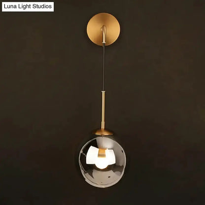Modern brass smoked glass globe pendant lamp by Decorbites with black cord on Tampa Home & Garden Store