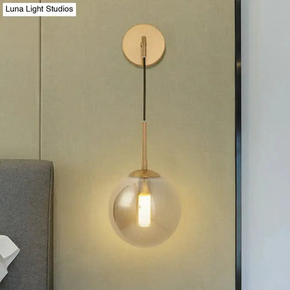 Modern brass smoked glass ball wall lamp for bedroom, hanging wall light with backplate on Tampa Home & Garden Store