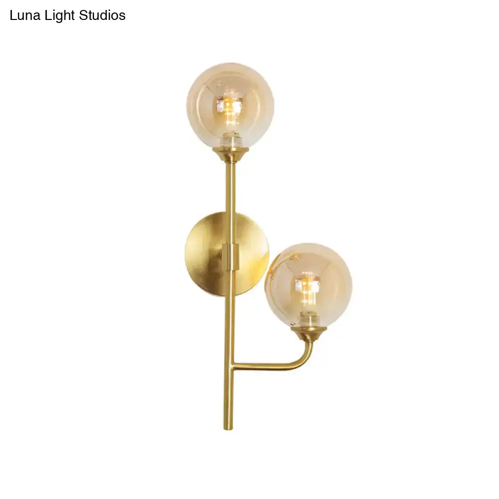 Brass sphere bathroom sconce by Decorbites with dual glass globes on Tampa Home & Garden Store