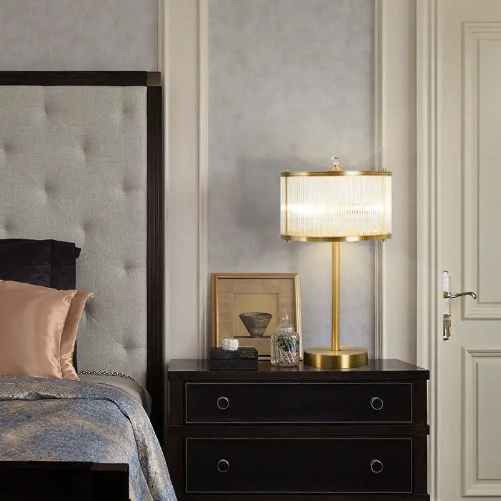 Brass glass table lamp by Decorbites with ribbed white shade on dark wood nightstand on Tampa Home & Garden Store