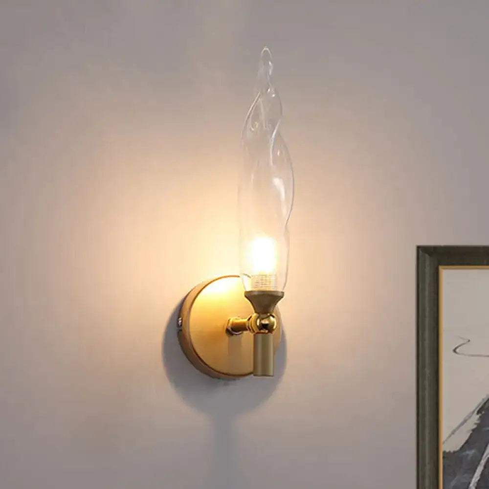Brass Torch Wall Sconce by Decorbites; brass finish, clear glass flame shade, wall mount on Tampa Home & Garden Store