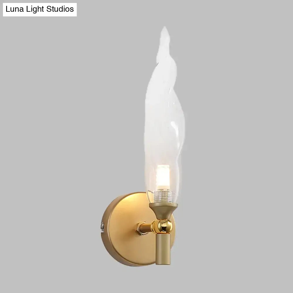 Brass Torch Wall Sconce by Decorbites; torch-style brass mount with clear glass flame shade on Tampa Home & Garden Store