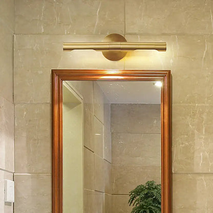 Brass Tube Vanity Light warm brass finish above a wood-framed bathroom mirror Decorbites on Tampa Home & Garden Store