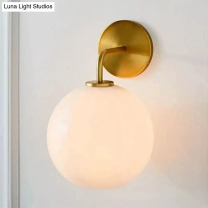 Modern Brass Wall Lamp with Glass Globe Bedroom