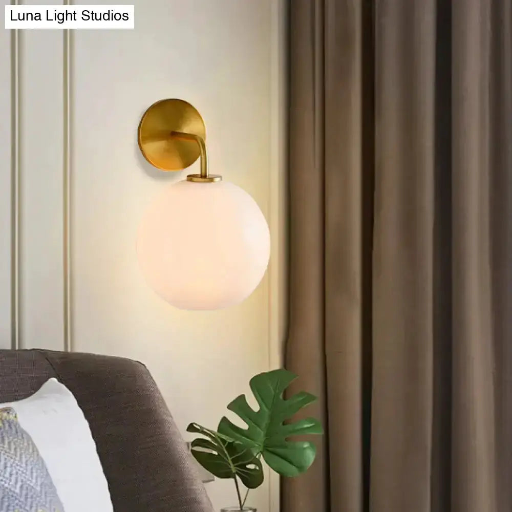 Modern Brass Wall Lamp with Glass Globe Bedroom