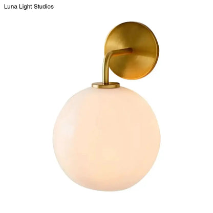 Modern Brass Wall Lamp with Glass Globe Bedroom