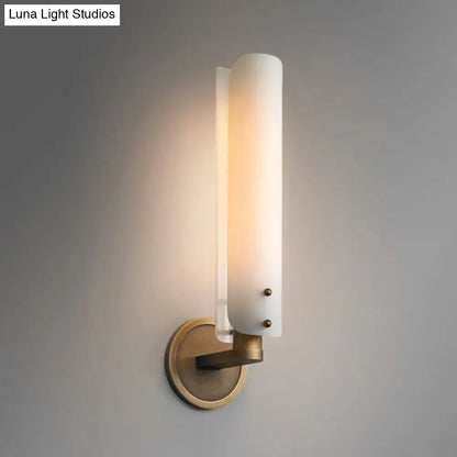 Decorbites brass opal glass wall sconce with tall frosted shade and round wall mount on Tampa Home & Garden Store