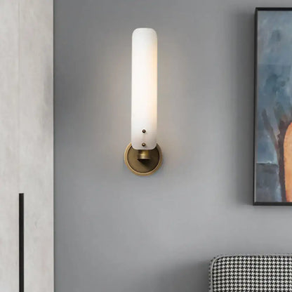 Brass Opal Glass Wall Sconce by Decorbites with frosted cylindrical shade on brass backplate on Tampa Home & Garden Store