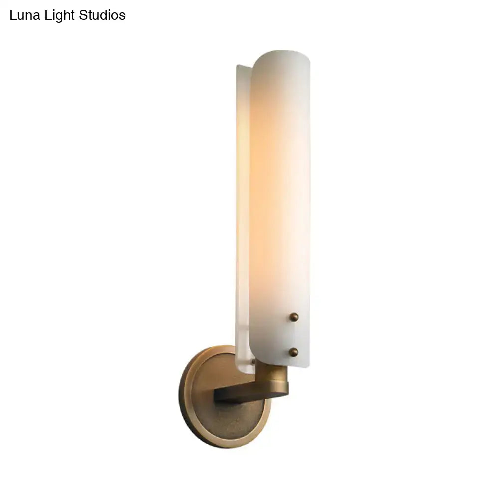 Brass Opal Glass Wall Sconce by Decorbites, vertical opal shade, brass mount, warm glow on Tampa Home & Garden Store