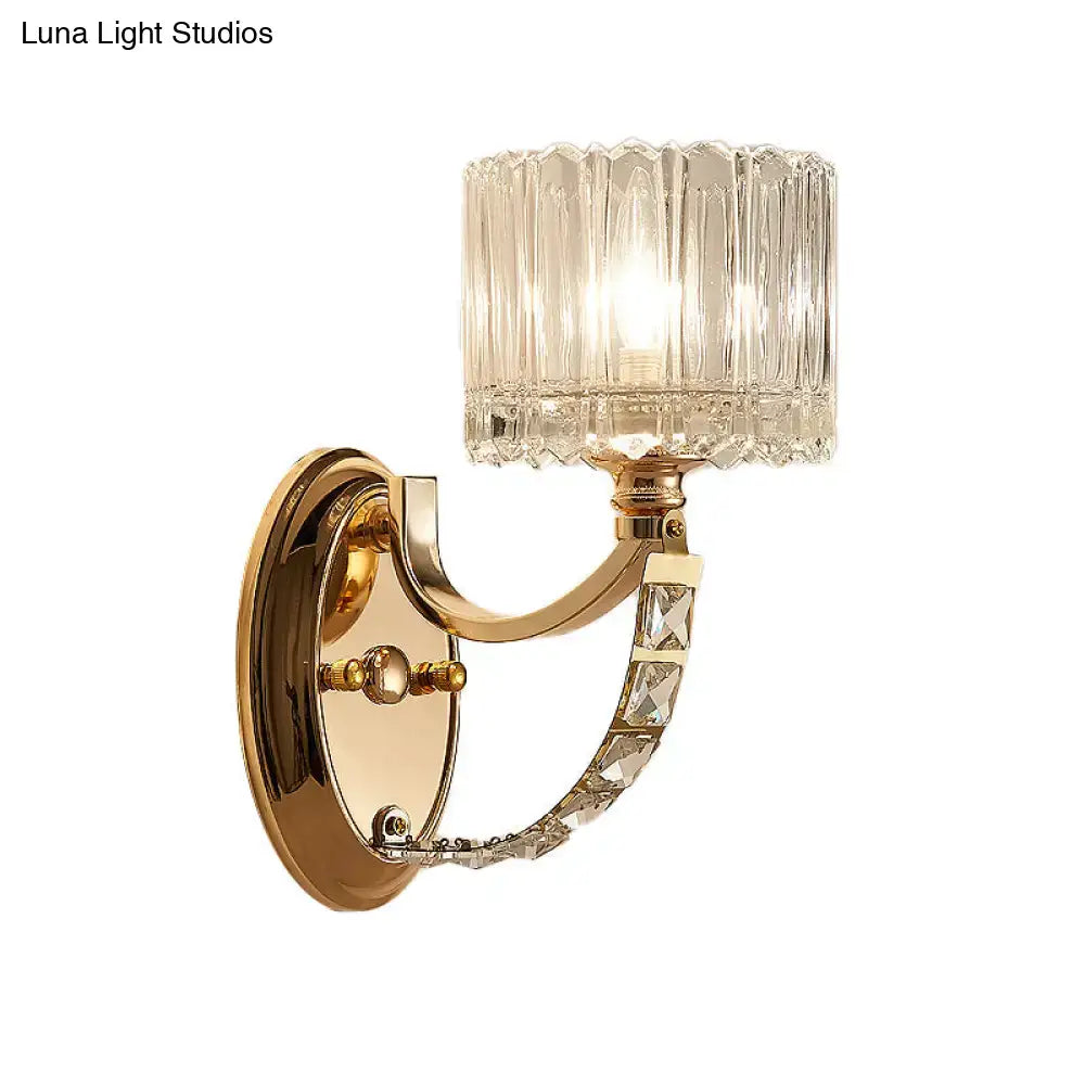 Brass faceted glass sconce with crystal-accent curved arm and square shade on Tampa Home & Garden Store
