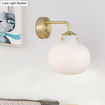Brass milk glass balcony sconce with curved arm, round backplate by Decorbites on Tampa Home & Garden Store