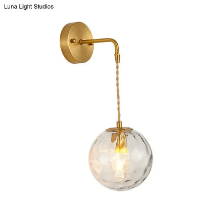 Brass water glass sconce with clear hammered glass globe and braided cord Decorbites on Tampa Home & Garden Store
