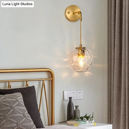 Brass Water Glass Sconce with clear glass globe, twisted fabric cord, wall-mount round plate on Tampa Home & Garden Store