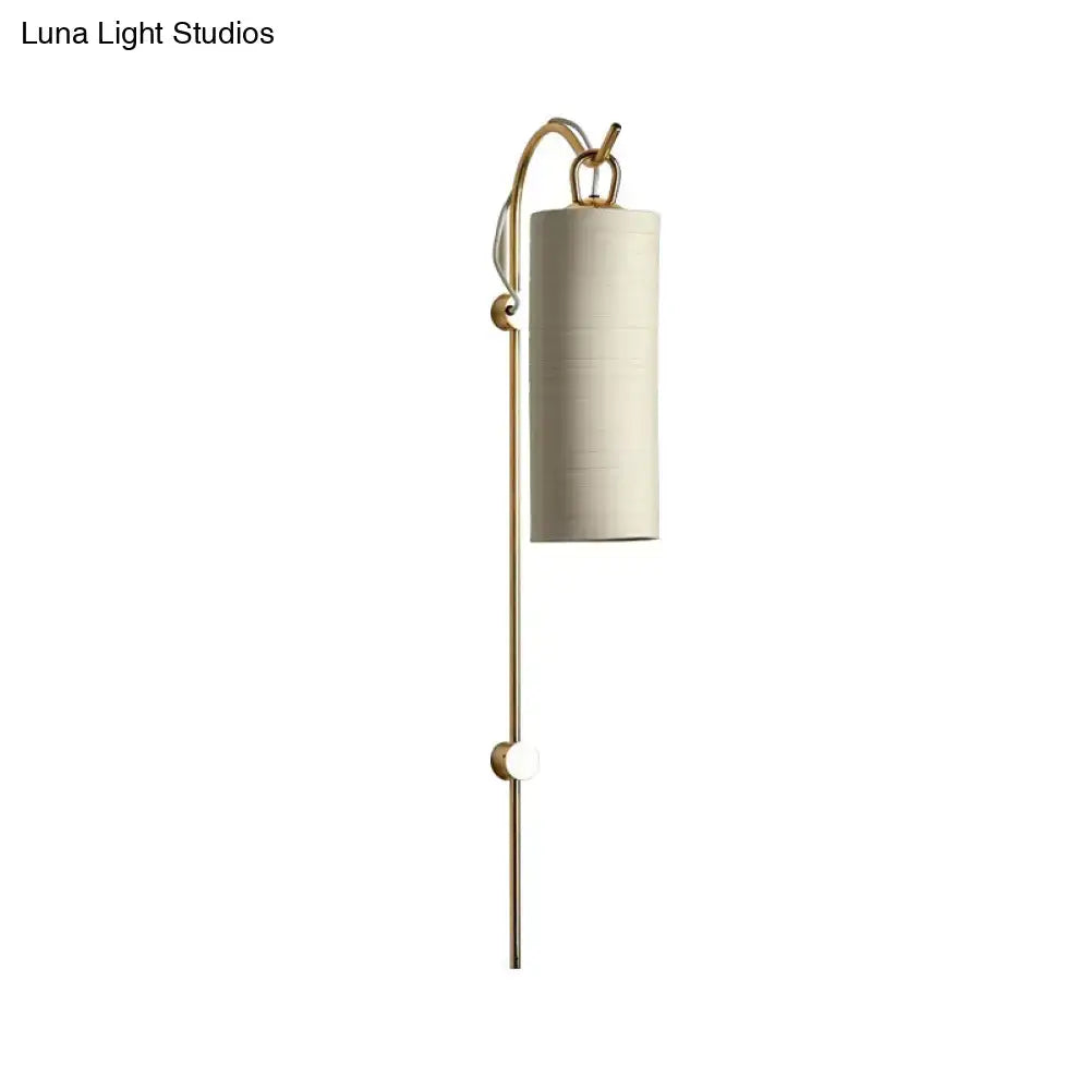 Brass white tube sconce by Decorbites with vertical brass stem and white cylindrical shade on Tampa Home & Garden Store