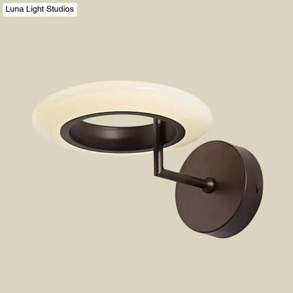 Bronze round LED wall lamp sconce with frosted white ring diffuser and dark bronze arm on Tampa Home & Garden Store