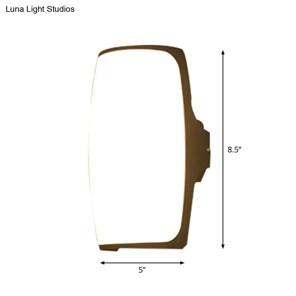 Decorbites brown rectangular LED wall light with curved frame, 5 in wide, 8.5 in tall on Tampa Home & Garden Store