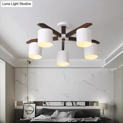Decorbites white brown ceiling chandelier with five white cylindrical shades and dark wood arms on Tampa Home & Garden Store