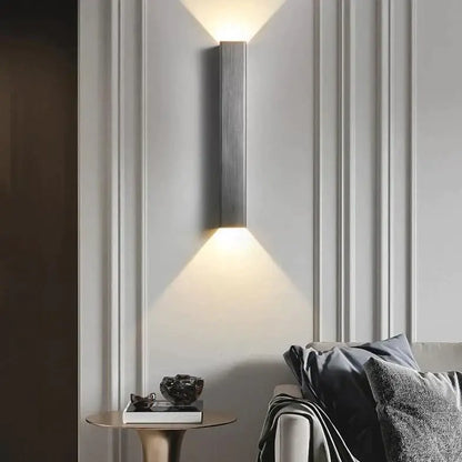Modern brushed aluminum rectangular wall sconce by Decorbites with upward glow on paneled wall on Tampa Home & Garden Store