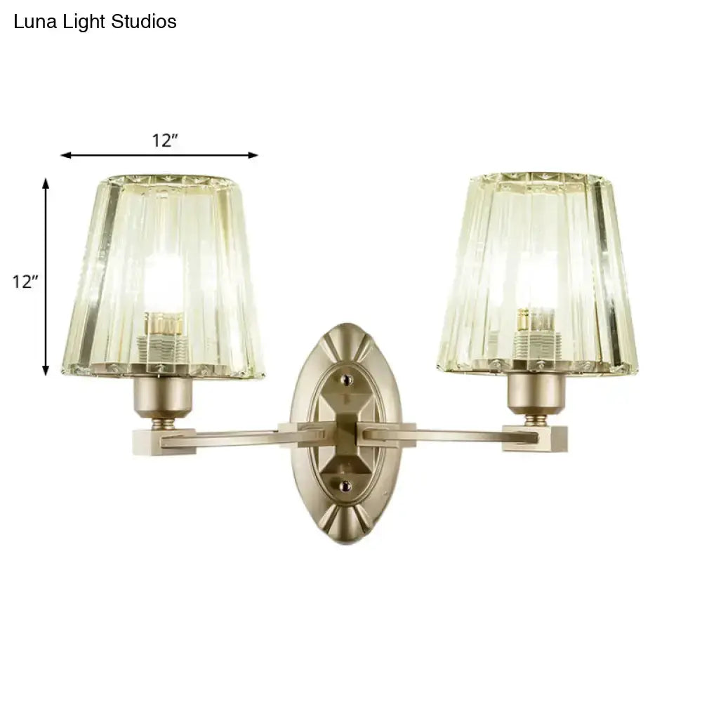Decorbites modern two-light wall sconce with brushed brass finish and green glass shades on Tampa Home & Garden Store