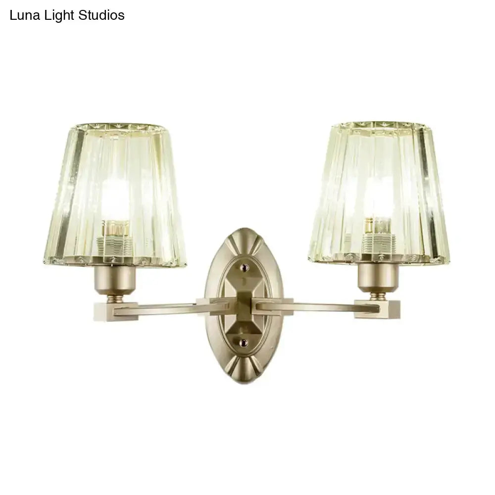 Double-arm wall sconce with brushed brass finish and green glass shades by Decorbites on Tampa Home & Garden Store
